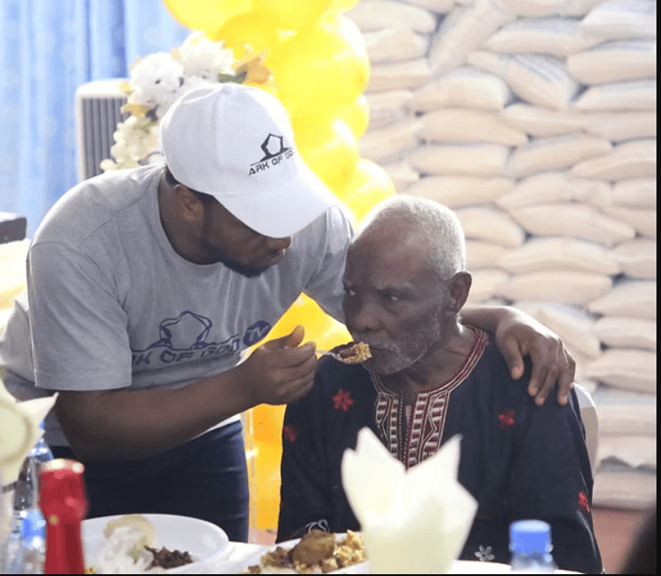 John Chi Feeding an elderly man!